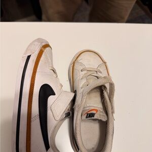 Nike White Sneakers with Black Swoosh and Orange Trim